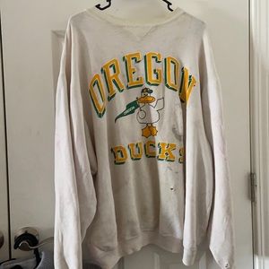 Vintage Oregon Ducks sweater in rough condition